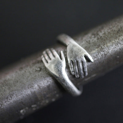 close up of silver hug ring on metal rod