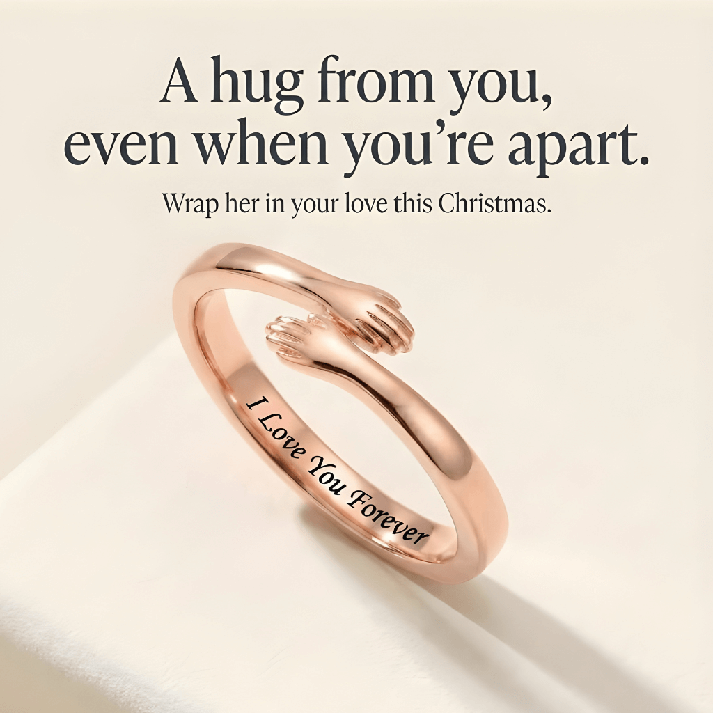 Detail view of  a tiny hands rose gold hug ring