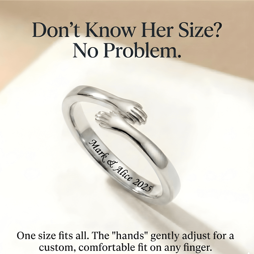 Close-up of a silver adjustable hug ring with small hands design, engraved with "Mark & Alice 2025' 
