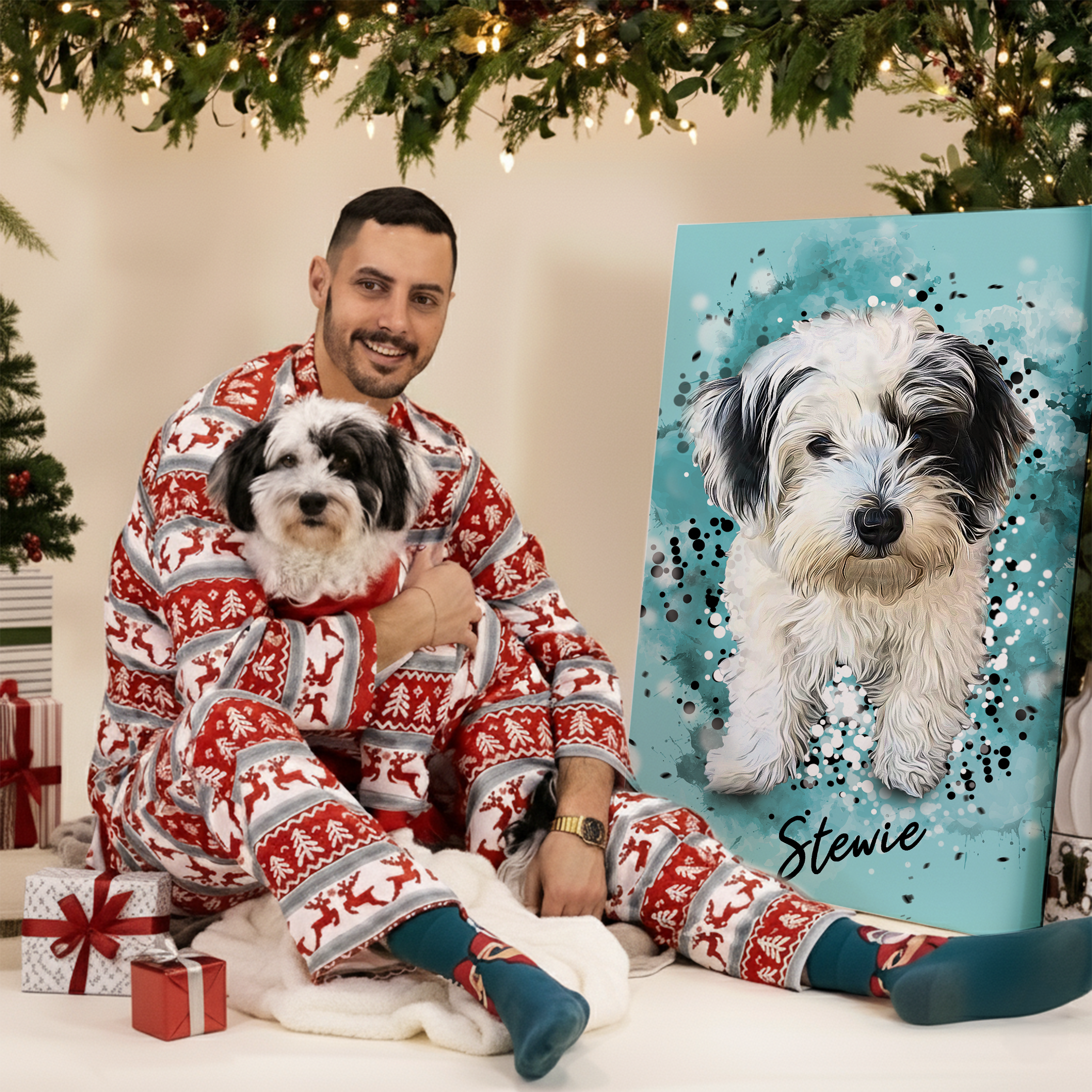 Man and dog in matching pyjamas sitting next to pet portrait canvas