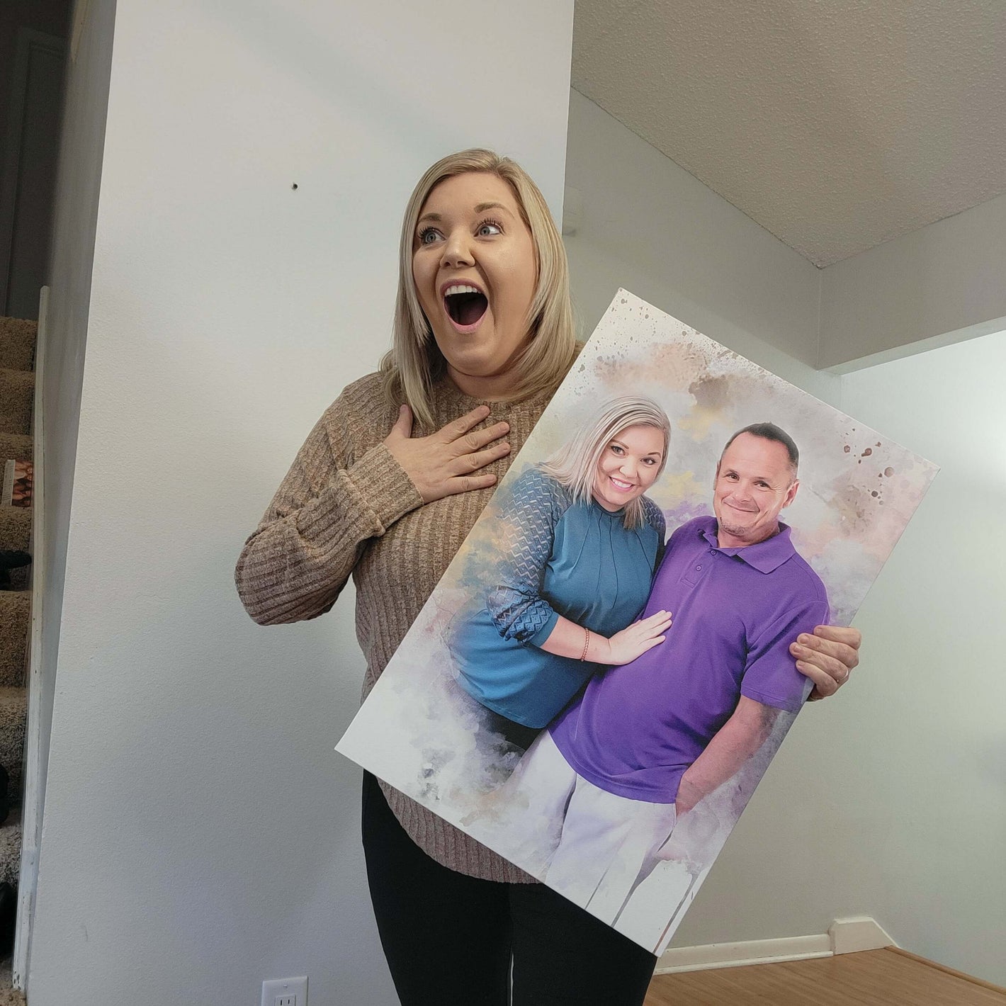 woman holding personalized couples portrait and looking shocked 