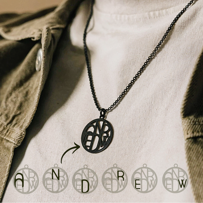 Man wearing black monogram necklace 
