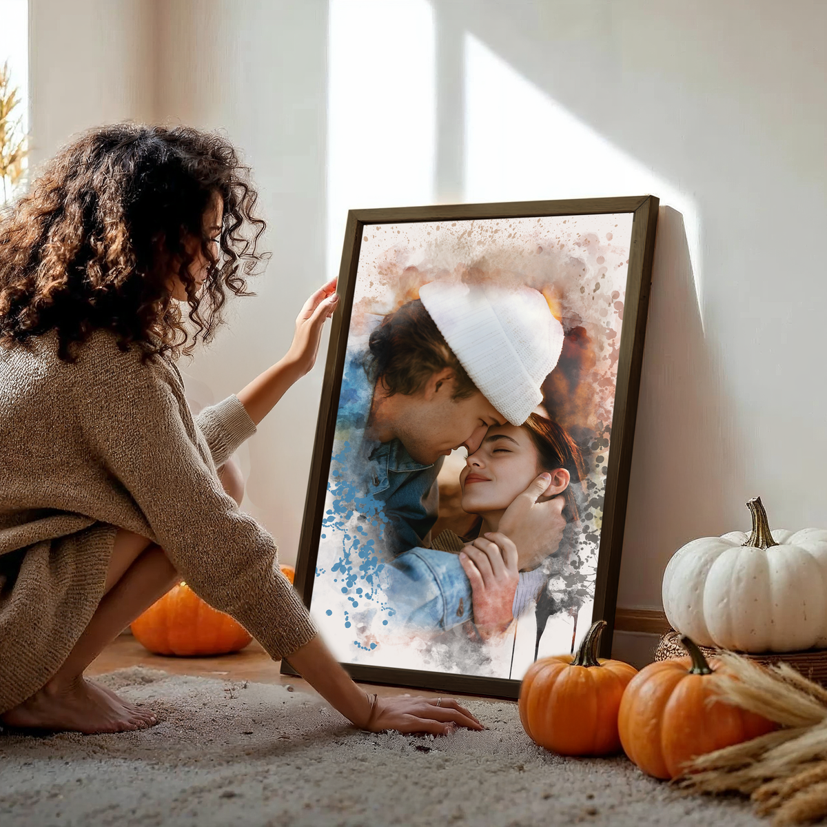 woman touching a framed couples portrait 