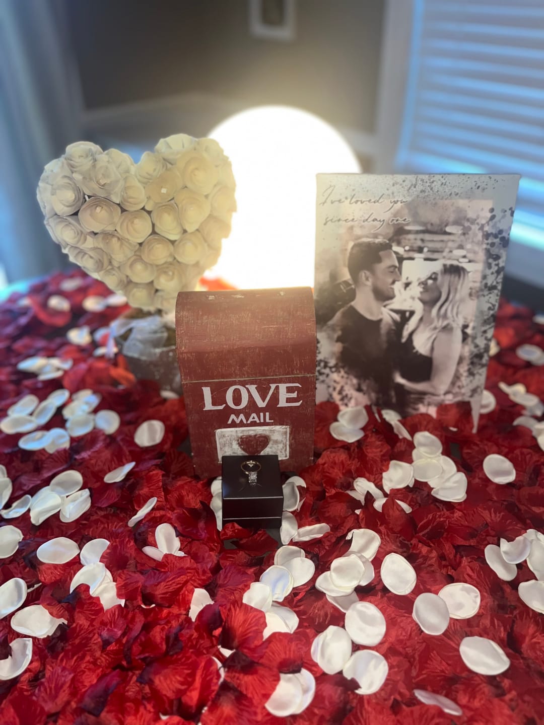 valentines setting with flowers and a black and white custom couples portrait canvas