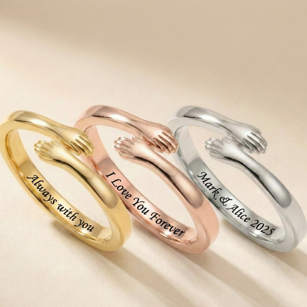 Close-up of three adjustable hug rings in different metals—gold, rose gold, and silver