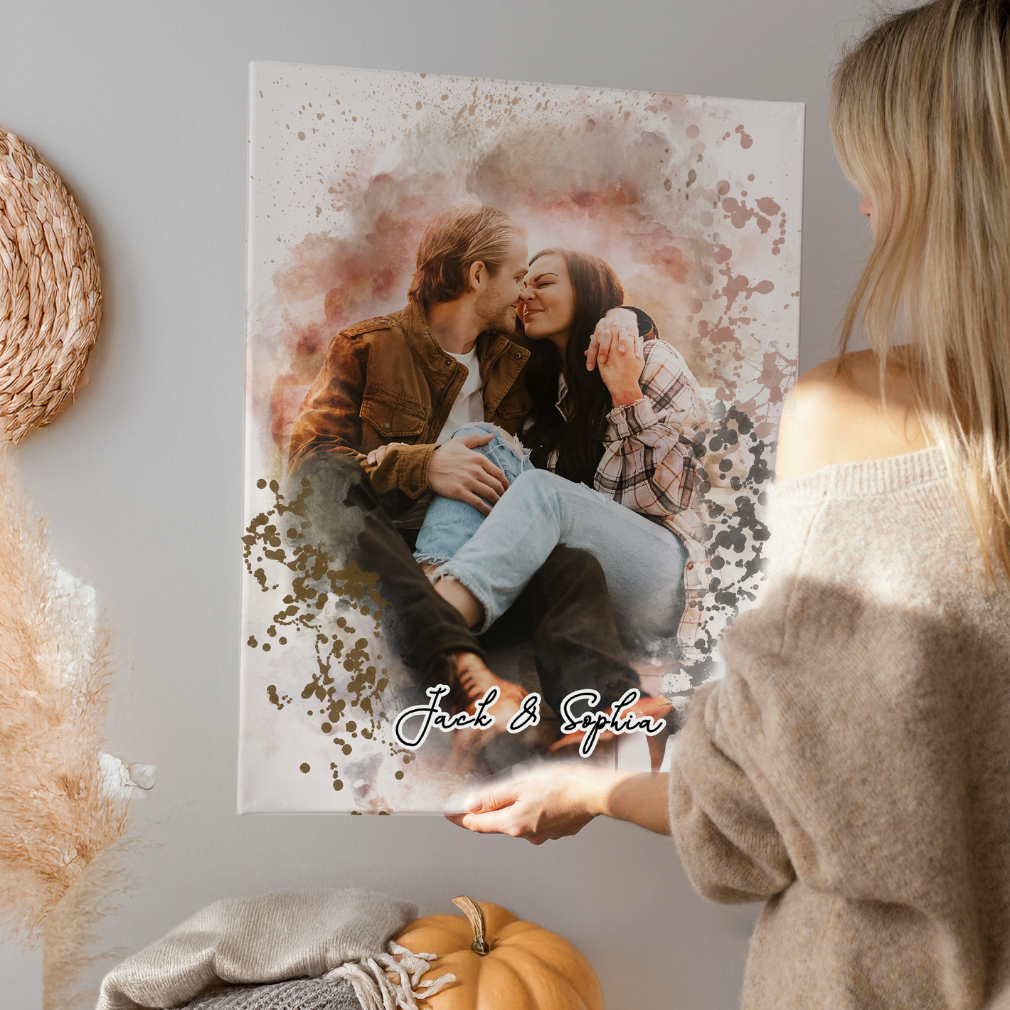 woman placing a personalized couples portrait on a wall