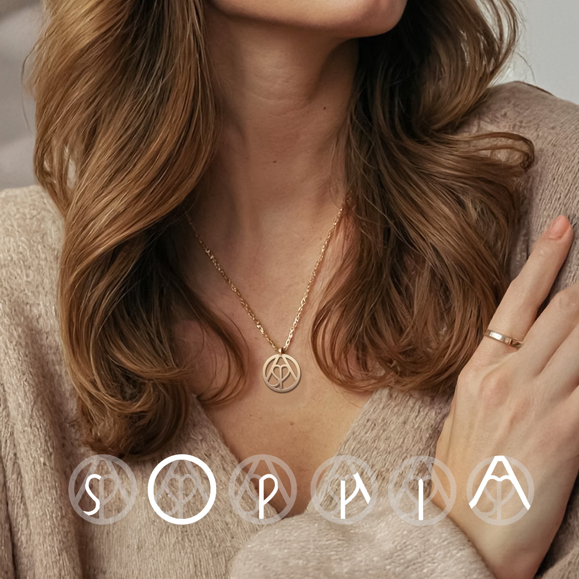 Woman wearing gold monogram necklace 