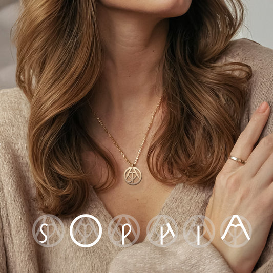 Woman wearing gold monogram necklace 