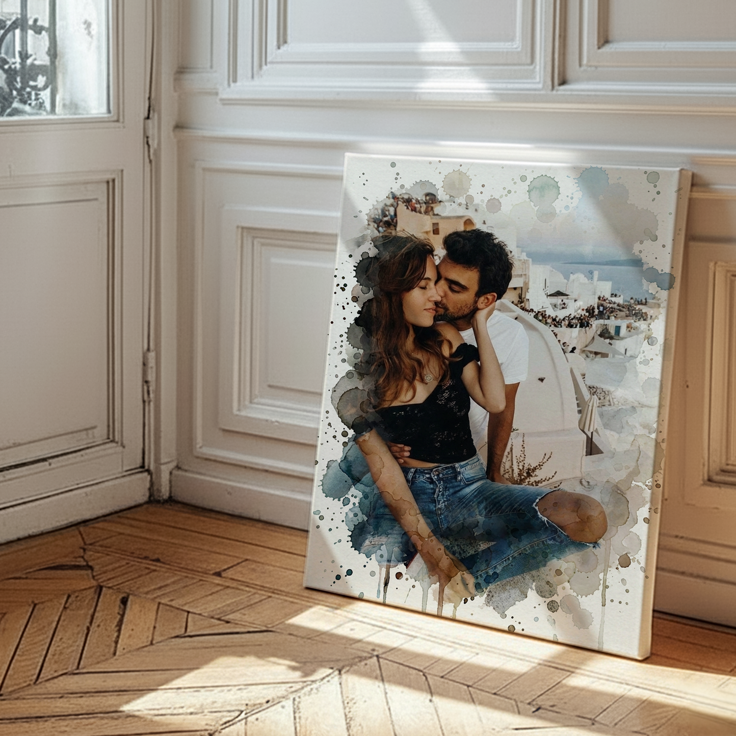 Large personalized watercolor canvas print of a couple embracing, leaning against a white wall and wood floor.