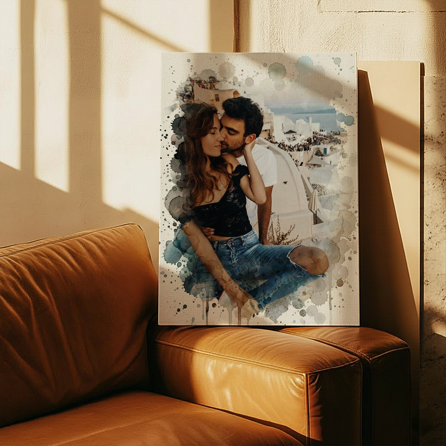 Couple embracing on a personalized canvas print leaning against a wall above a leather couch.
