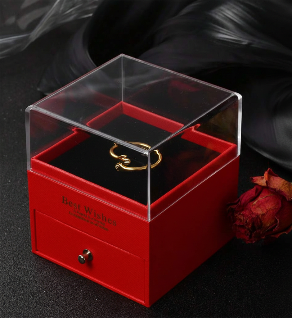 red gift box with gold hug ring inside