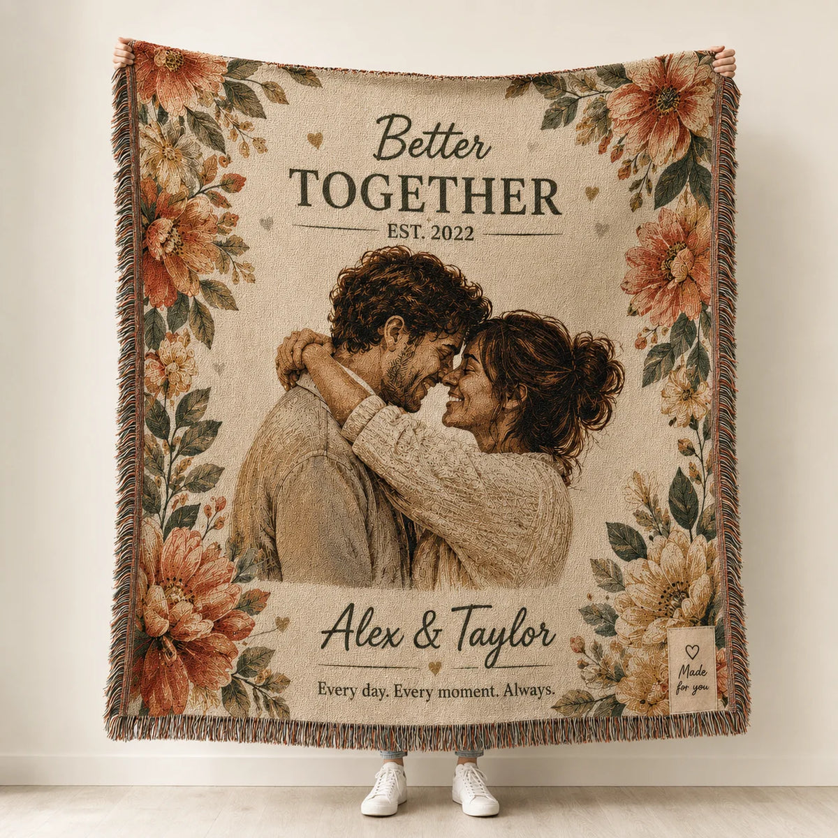 Custom couple woven blanket in the Better Together floral design held up, with names, est. year and tagline