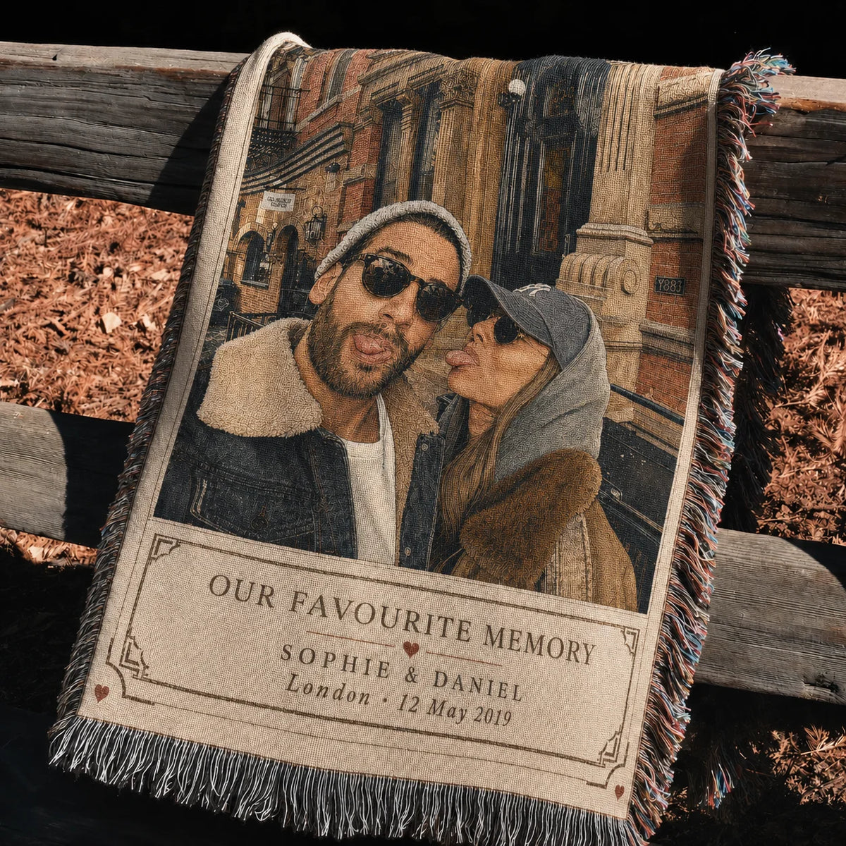 Favourite Memory custom couple woven blanket draped over a rustic fence outdoors, showing woven detail and fringe