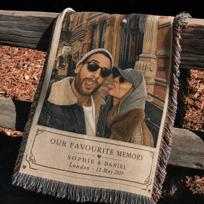 Favourite Memory custom couple woven blanket draped over a rustic fence outdoors, showing woven detail and fringe