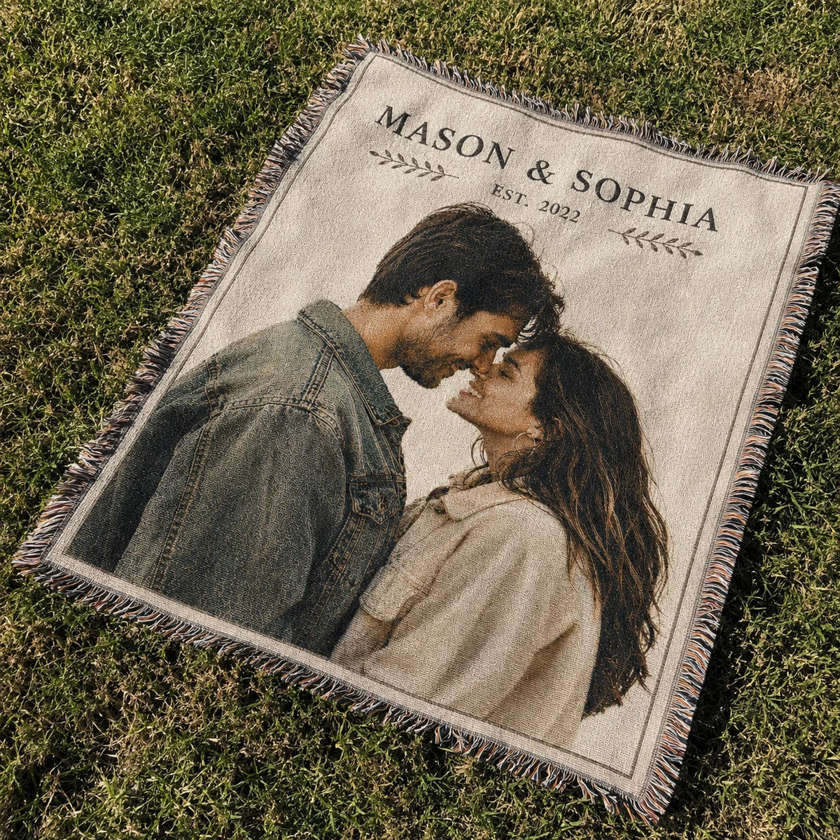 Simply Us custom couple woven blanket spread on grass as a picnic blanket, showing names and est. year