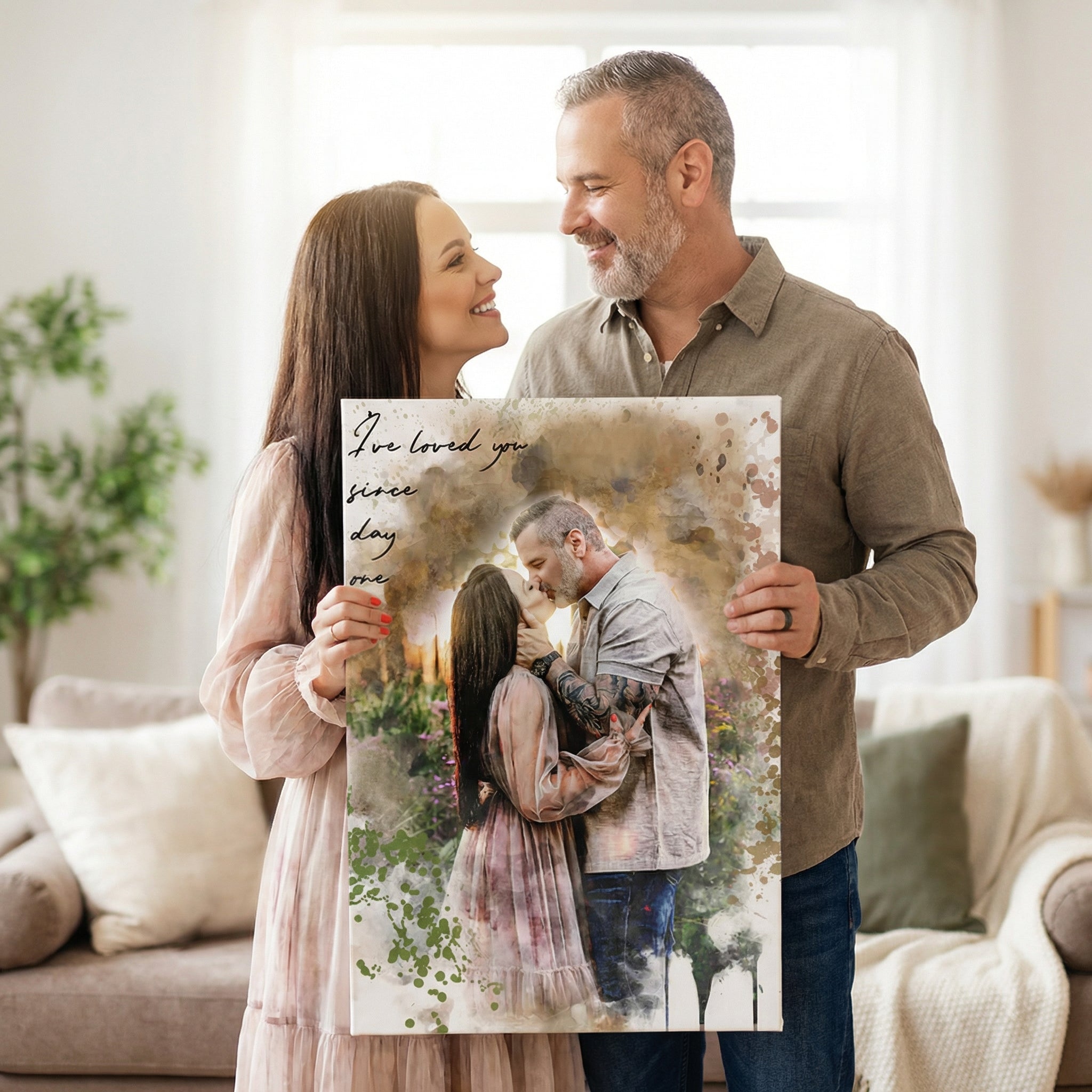 couple gazing at each other and holding watercolor styled artwork