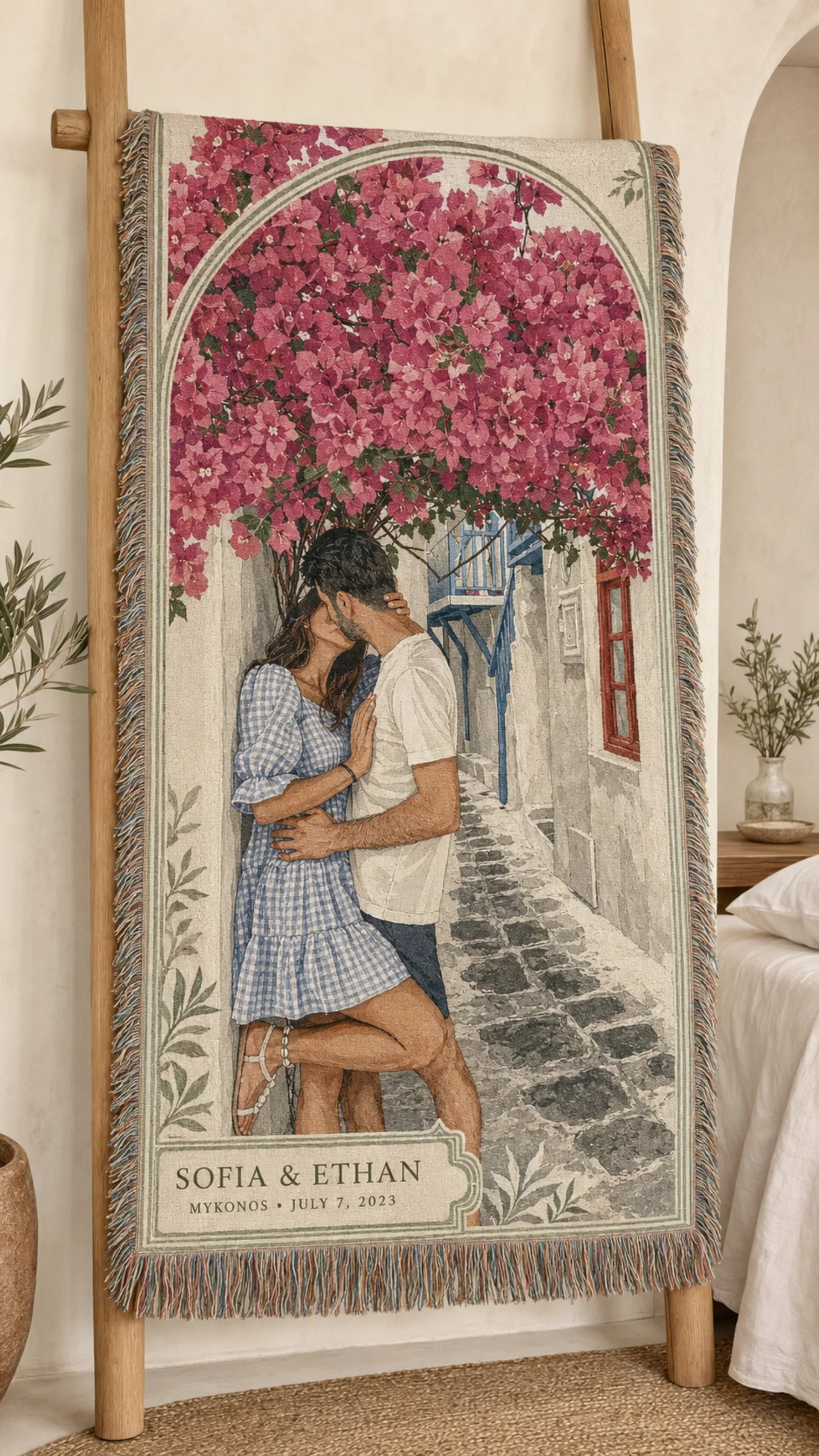 Mykonos Bloom custom couple woven blanket displayed on a wooden ladder