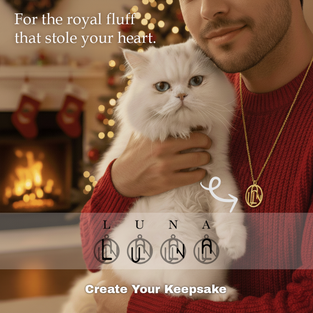 man wearing gold monogram necklace and holding white cat with a text overlay that says for the royal fluff that stole your heart 