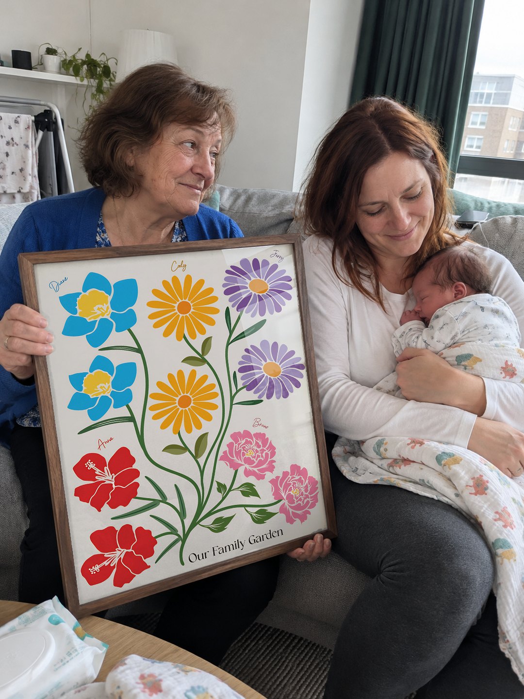 Grandma holding the family garden next to a newborn
