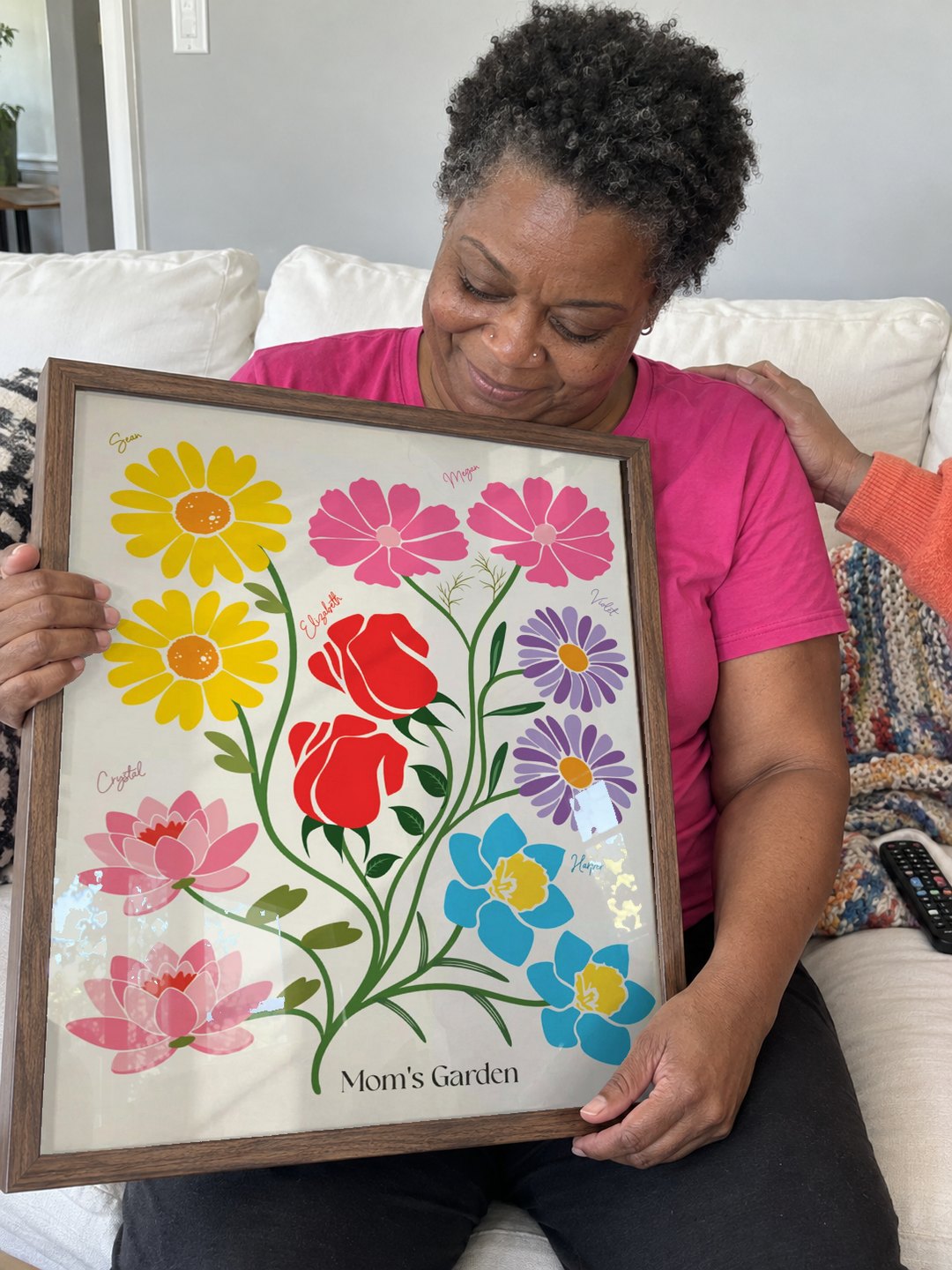 Mom smiling down at her garden after it arrived