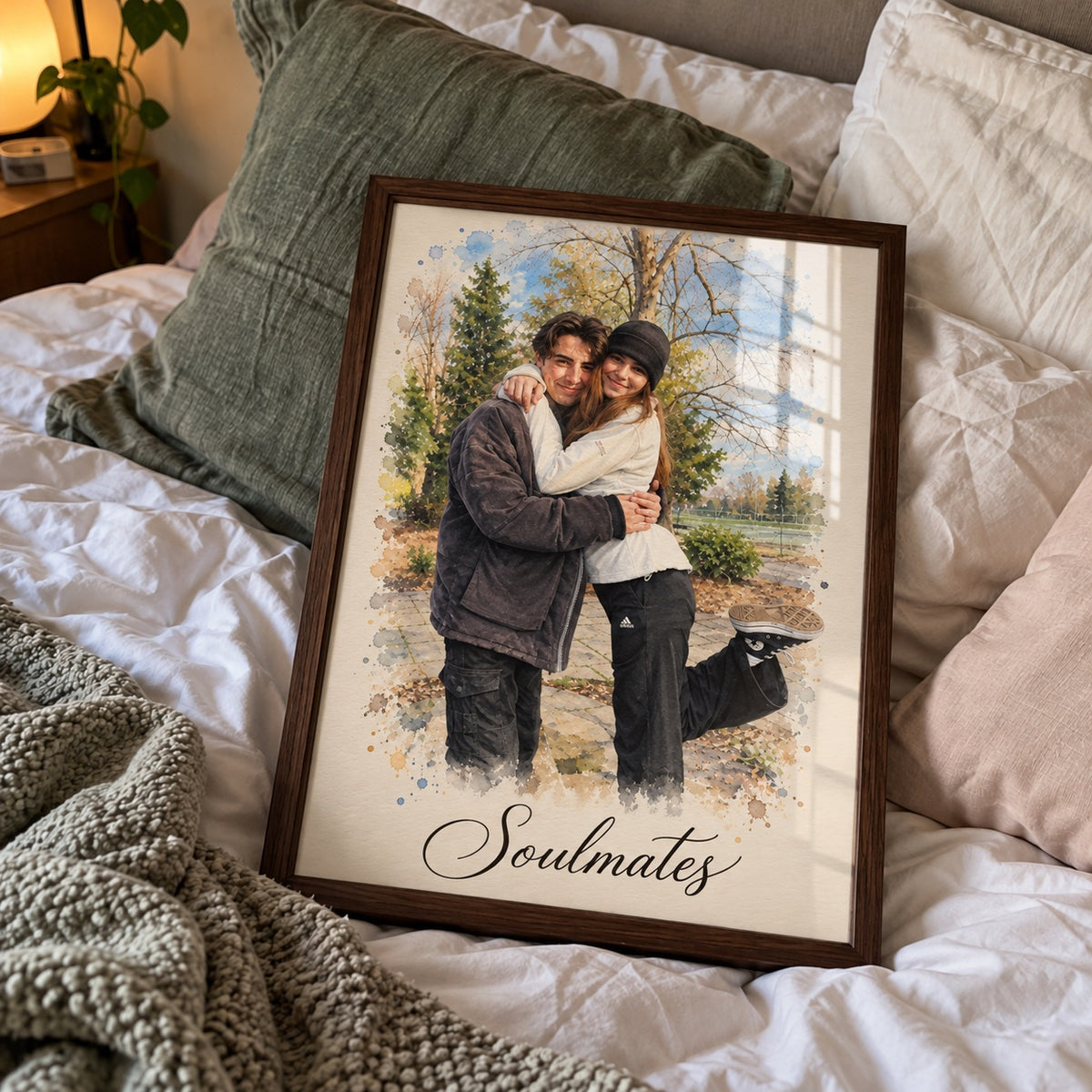 Framed couple portrait 'Soulmates' resting on a bed