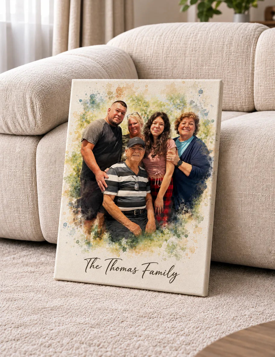 A canvas watercolor portrait of five family members leans on a cream sofa.