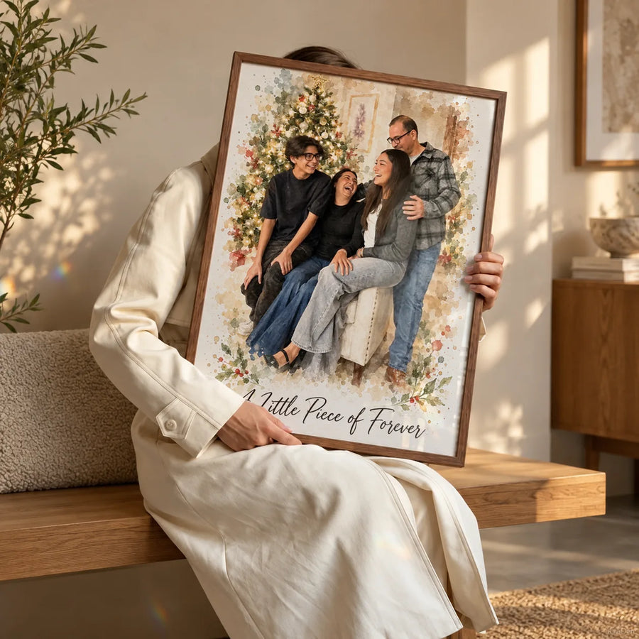 A woman sits on a bench holding a framed watercolor family portrait that shows a Christmas tree behind the family.
