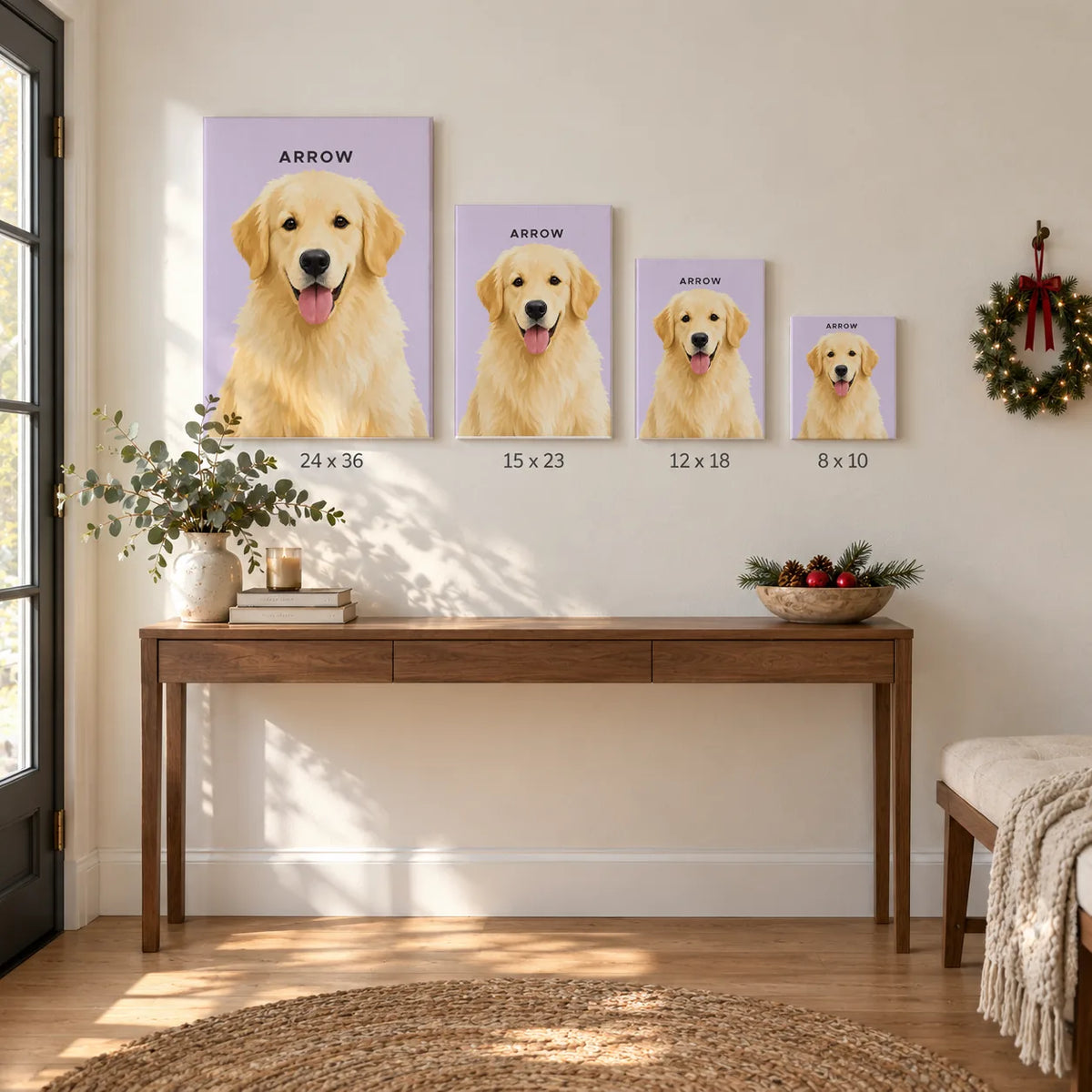 Four canvas portraits of a golden retriever in different sizes hang above a hallway table with a holiday wreath.