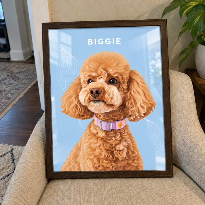 Custom pet portrait of a poodle named Biggie on a light blue background, in a dark wood frame on an armchair