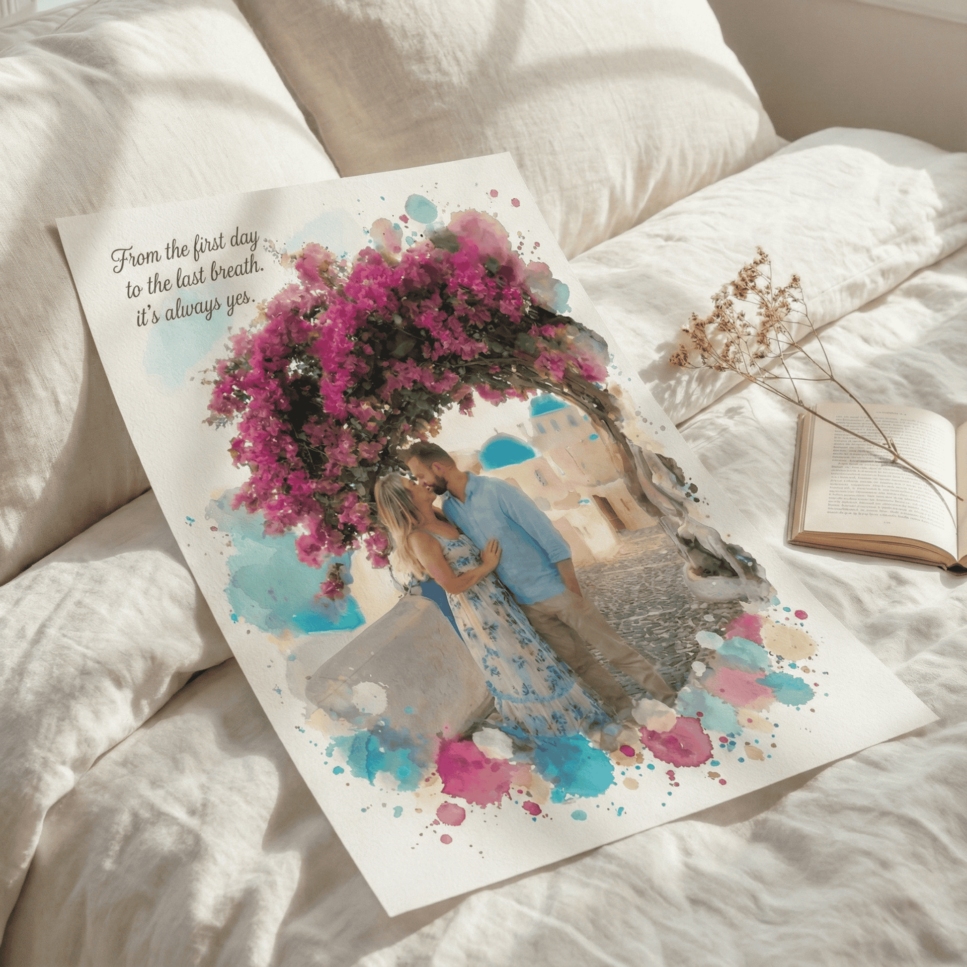 Personalized watercolor print of a couple kissing under pink bougainvillea with blue accents, text says "From the first day to the last breath, it's always yes," lying on a bed.